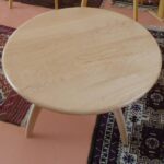 in curly maple with a clear (natural) finish. custom revolving coffee table