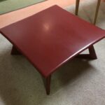 M392Cocktail table refinished in red lacquer