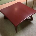M392 Cocktail table refinished in red lacquer M392