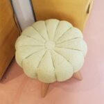 Sculptura vanity pouffe with original upholstery. Base refinished Champagne