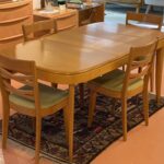 Table was previously coated with -something- over the original champagne finish. Not a superb job but it does add protection. Chairs are in good condition but you would probably want to replace the fabric. $650
